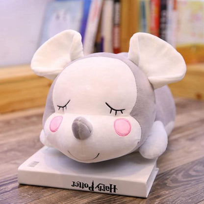 Mouse doll lying on the mouse pillow