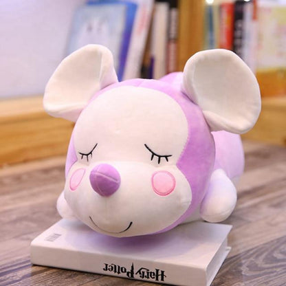 Mouse doll lying on the mouse pillow